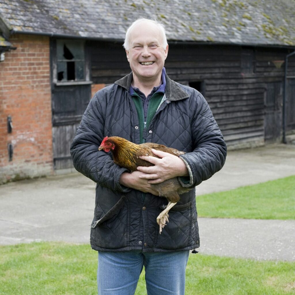 Farmer holding chicken